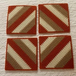 VINTAGE COASTERS (4) PLASTIC CANVAS NEEDLE WORK-RUST/TAN/WHITE CORK BACK 4”